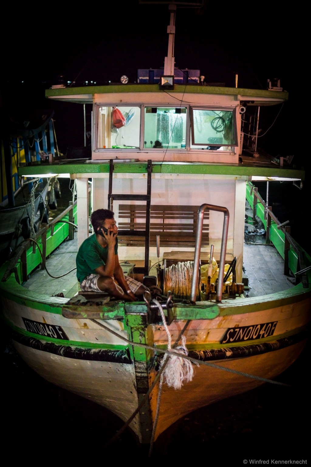 A fisherman sitting in his fishing boat in Kota Kinabalu, Malaysia.